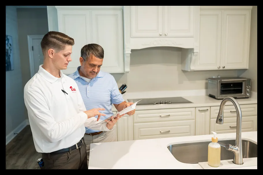 employees in the kitchen reviewing pest control