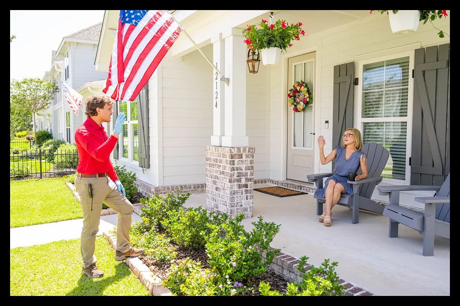 an employee in front of a house