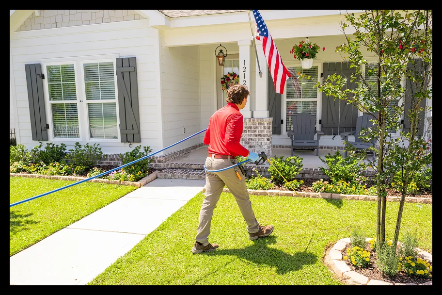 an employee in front of a house