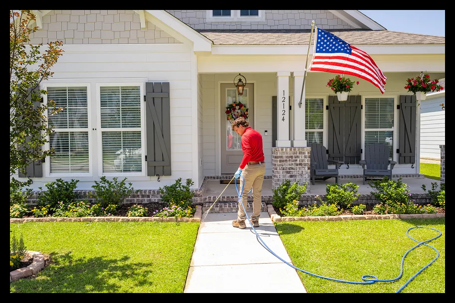 an employee in front of a house