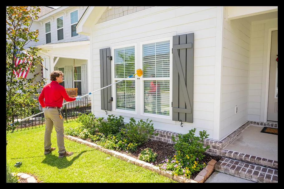 an employee in front of a house